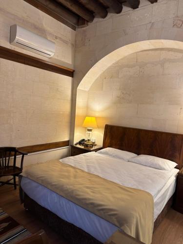 Postel nebo postele na pokoji v ubytování Tas Konak Hotel-City Center