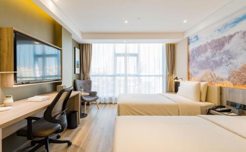 Katil atau katil-katil dalam bilik di Atour Hotel Kunming Dashanghui
