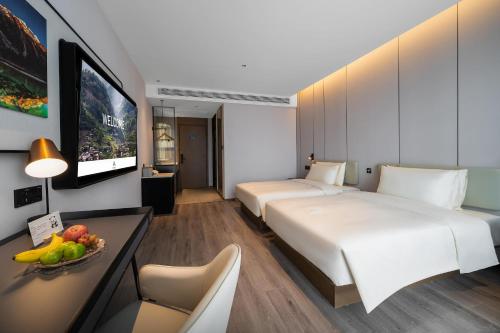 Katil atau katil-katil dalam bilik di Atour Hotel Chengdu Dujiangyan Darong City