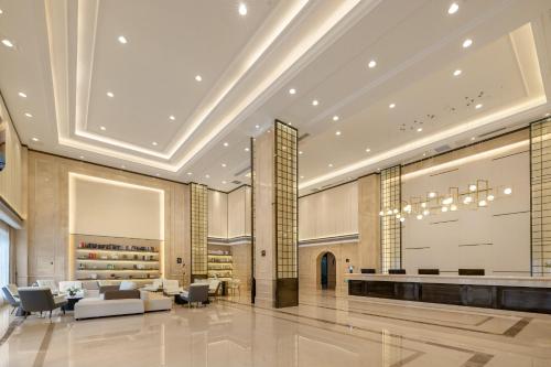 a lobby of a hotel with a large screen at Atour X Hotel Shenzhen Baoan Airport Aviation City in Bao'an