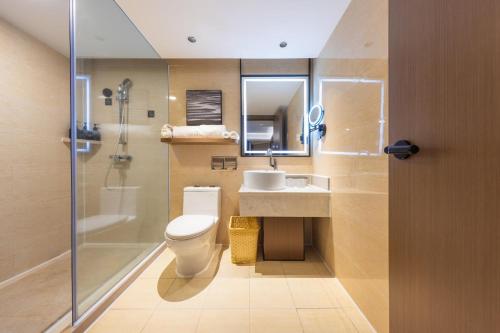 a bathroom with a toilet and a sink and a shower at Atour X Hotel Shenzhen Luohu Sungang Baoneng Center in Shenzhen
