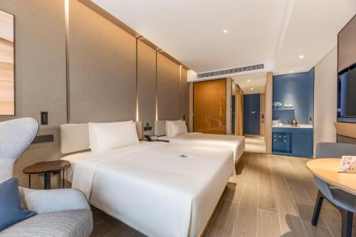 Cama o camas de una habitación en Atour Hotel Zhijiang Bridge