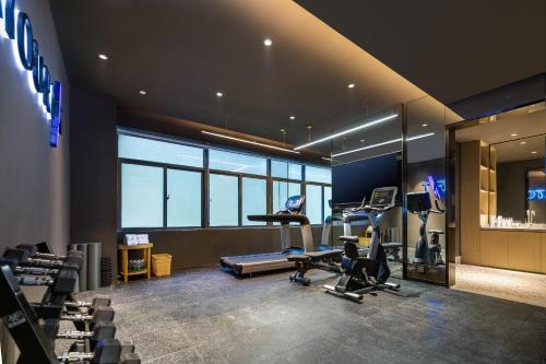 a gym with treadmills and exercise equipment in a building at Atour X Hotel Shenzhen Baoan Airport Aviation City in Bao'an