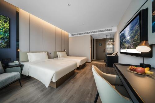 Katil atau katil-katil dalam bilik di Atour Hotel Chengdu Dujiangyan Darong City