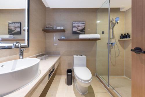a bathroom with a toilet and a sink and a shower at Atour X Hotel Shenzhen Luohu Sungang Baoneng Center in Shenzhen