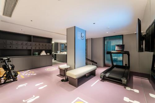 a room with a gym with a camera in it at Atour Hotel ShanghaiPeople's Square Xintiandisubway - FreeMini Bar and Free NightSnacks in Shanghai