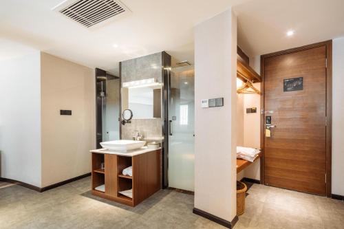 a bathroom with a sink and a shower at Atour X Hotel Kunming Cultural Palace East Renmin Road in Kunming