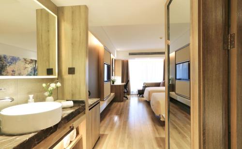 TV a/nebo společenská místnost v ubytování Atour Hotel Xi'an Xixian Vientiane City