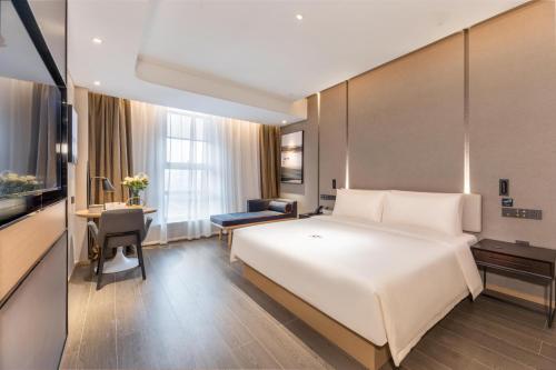 Cama o camas de una habitación en Atour Hotel Zhijiang Bridge