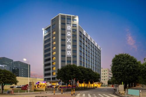 a tall building with writing on the side of it at Atour X Hotel Shenzhen Baoan Airport Aviation City in Bao'an