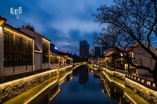 a canal in a city at night at InterContinental Changzhou by IHG in Changzhou