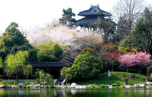 a pagoda in a park next to a lake at InterContinental Changzhou by IHG in Changzhou
