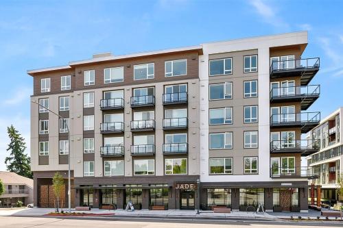 an apartment building with balconies on a street at Kirkland 1br w wd nr groceries shopping SEA-685 in Kirkland