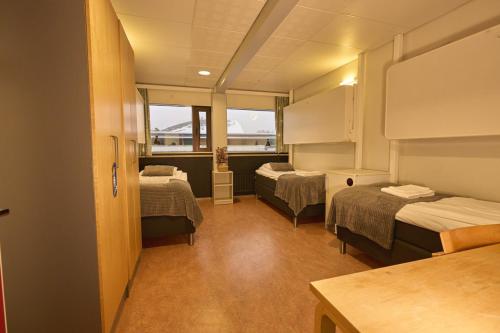 Un ou plusieurs lits dans un hébergement de l'établissement Hotel Tikkurila