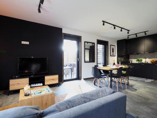 a living room with a couch and a table at Mokre 22 in Bielsk Podlaski
