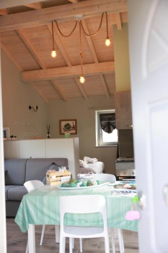 a living room with a table and a couch at Il Paradiso di Pietra in Filetto