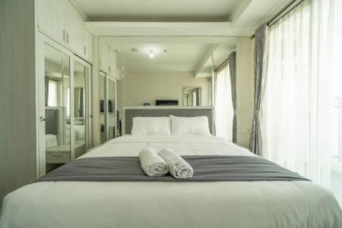 Un ou plusieurs lits dans un hébergement de l'établissement simple & stylish studio in central Jakarta, SCBD