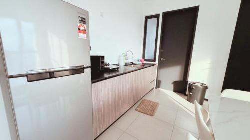 a small bathroom with a sink and a toilet at DeLuma-Urban Suites in Jelutong