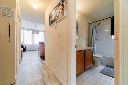 a bathroom with a toilet and a sink and a tub at Waterfront Gem, 2 Bedroom HOA Community of Whitestone BRONX Free Parking in Whitestone