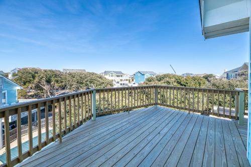 a wooden deck with a view of the ocean at Duck R Way in Duck