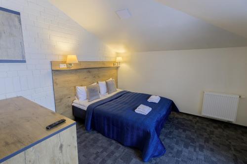 Ein Bett oder Betten in einem Zimmer der Unterkunft Loft Inn SELF-CHECK IN