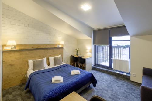 Postel nebo postele na pokoji v ubytování Loft Inn SELF-CHECK IN