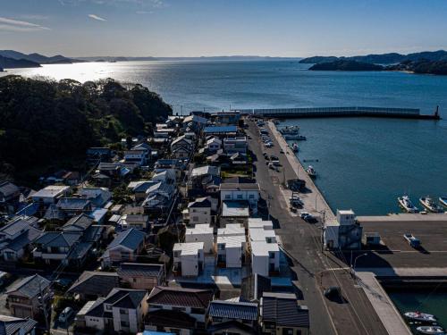 an aerial view of a harbor with houses and the water at Rakuten STAY HOUSE x WILL STYLE Itoshima in Itoshima