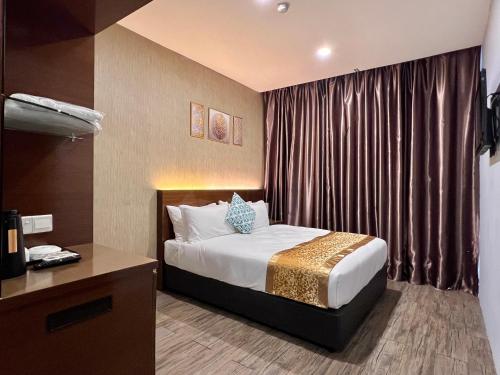 Postel nebo postele na pokoji v ubytování HSK Hotel Kuala Lumpur
