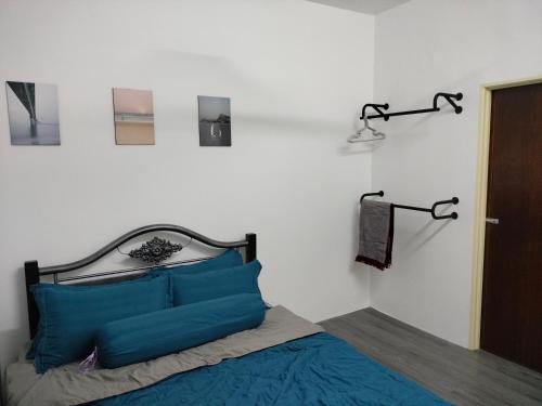 מיטה או מיטות בחדר ב-AZK HOMESTAY