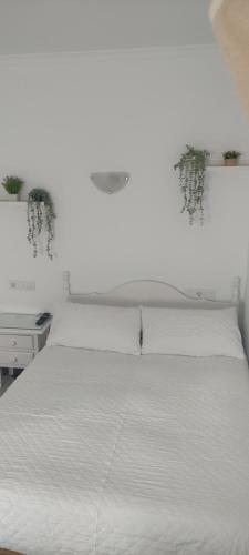 Katil atau katil-katil dalam bilik di Hostal Restaurante La Giralda