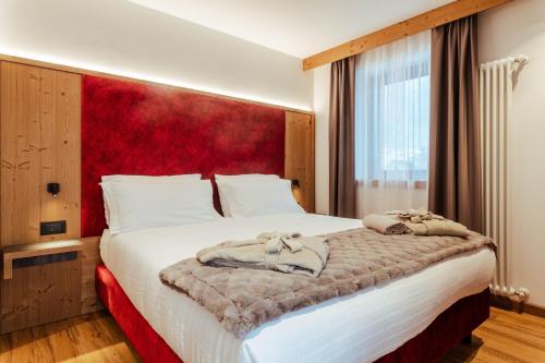 Postel nebo postele na pokoji v ubytování Hotel Villa Melì
