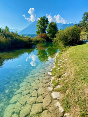 a river with rocks in the water at Natalies Hideaway in Thun