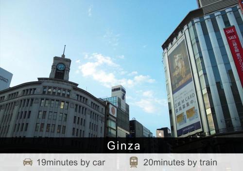 a city with tall buildings with a clock tower at Tokyu Stay Aoyama Premier in Tokyo
