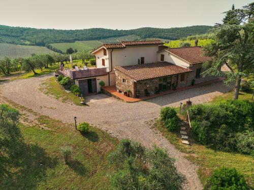 an aerial view of a house in a field at Tenuta il Poggetto in Radda in Chianti