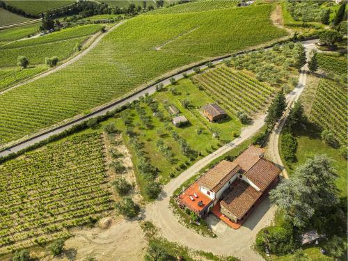 an aerial view of a house in a field at Tenuta il Poggetto in Radda in Chianti