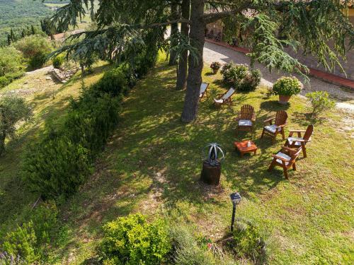 an overhead view of a park with chairs and a tree at Tenuta il Poggetto in Radda in Chianti