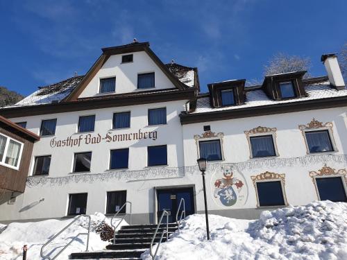 a building with snow in front of it at Gasthof Bad Sonnenberg in Nüziders