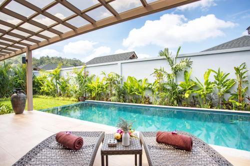 an image of a villa with a swimming pool at Beach escape at Villa Dalaa 8 in Kamala Beach