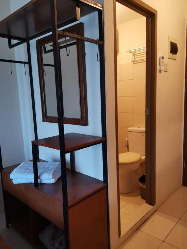 a bathroom with a bunk bed and a toilet at Pleasant05tifolia in Jakarta