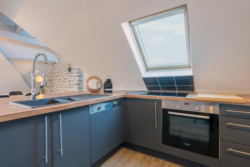 Η κουζίνα ή μικρή κουζίνα στο Appartement de charme