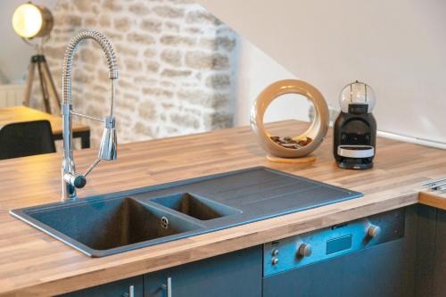 Η κουζίνα ή μικρή κουζίνα στο Appartement de charme