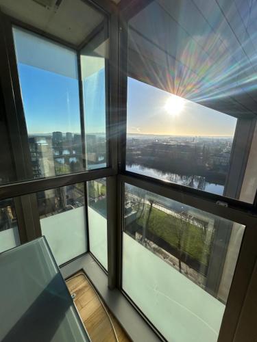 a view from the window of a skyscraper at Riverside Apartments in Glasgow
