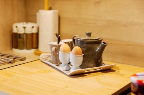 a tray with two eggs on a table at L'Escale du Léman in Publier