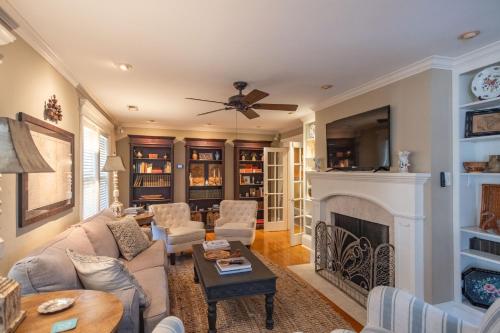a living room with a couch and a fireplace at Southern Elegance in Heart of Memphis in Memphis