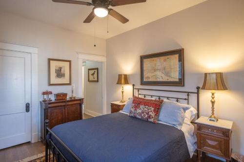 a bedroom with a bed and a ceiling fan at Classic Central Gardens Flat in Memphis