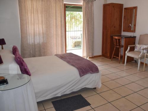 Ένα ή περισσότερα κρεβάτια σε δωμάτιο στο Blommenberg Guest House