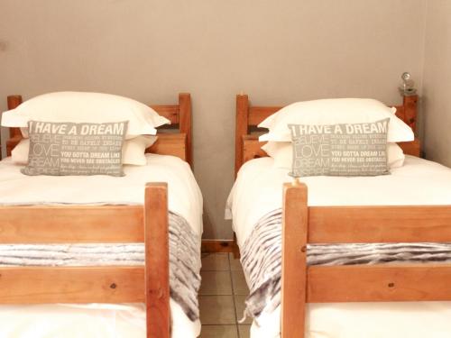 Ένα ή περισσότερα κρεβάτια σε δωμάτιο στο Blommenberg Guest House