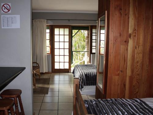 Ένα ή περισσότερα κρεβάτια σε δωμάτιο στο Blommenberg Guest House