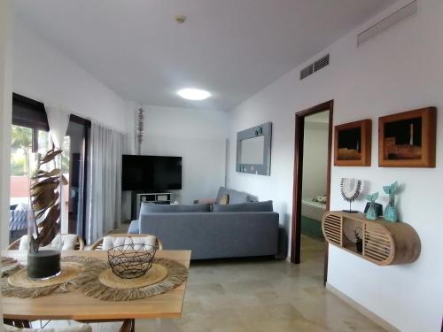 a living room with a couch and a table at CN-340 Suites in Estepona