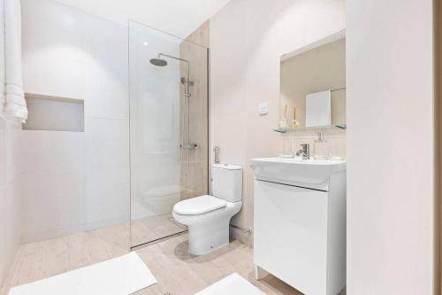 a bathroom with a toilet and a sink and a shower at Exclusive Dubai Marina Two Bedroom Suite by Jumeirah Beach, Mall and Metro in Dubai